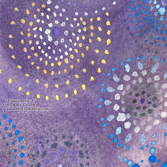 close-up of abstract art with metallic dotted circles on a purple background