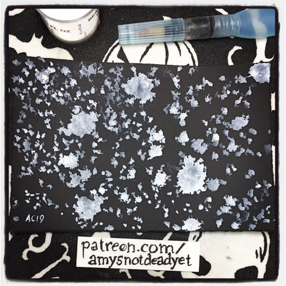 an abstract painting in ink on black paper of snow falling by Amy Crook