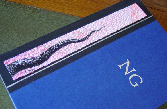 Tentacle Bookmark 1, with book, by Amy Crook
